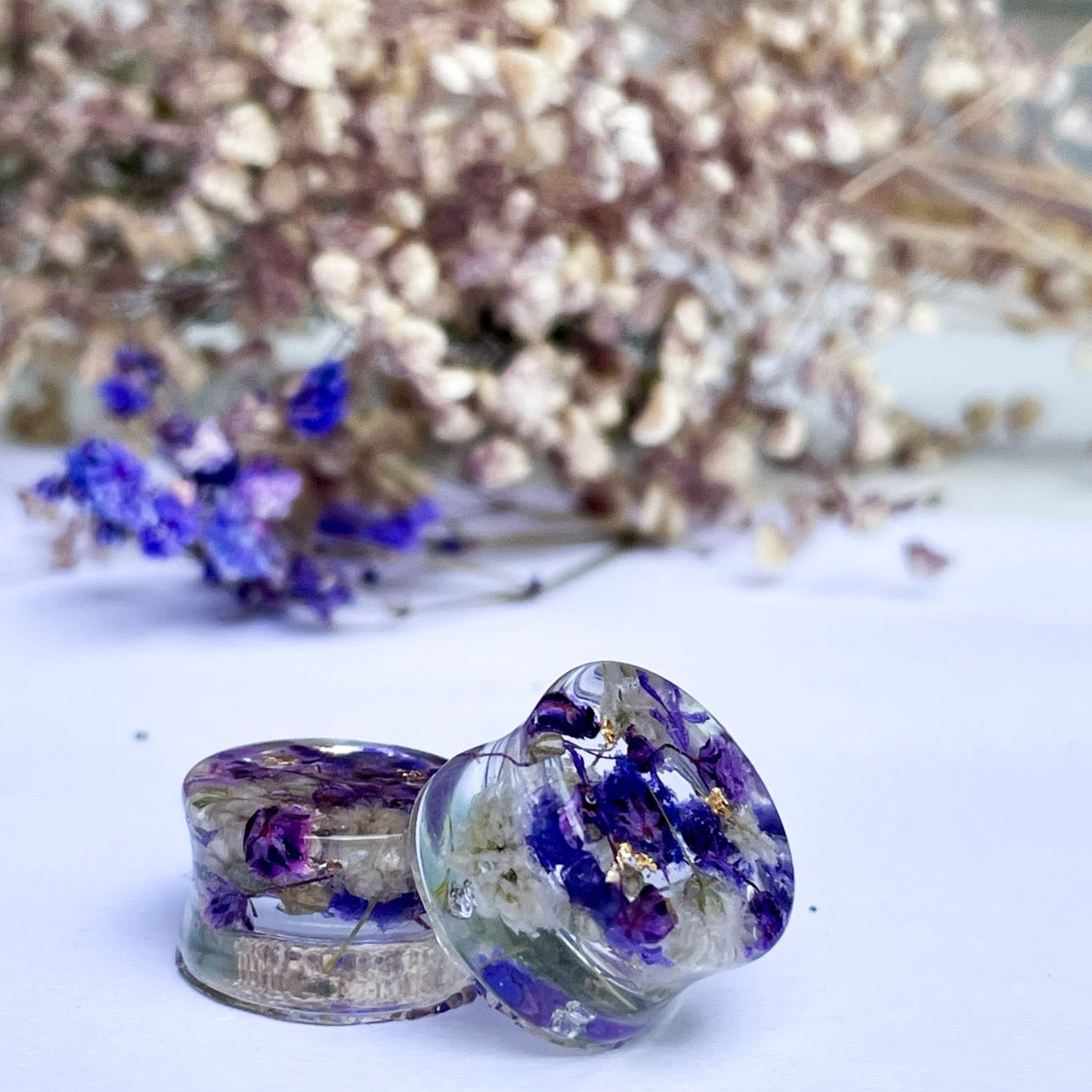 Purple and White transparent ear gauges