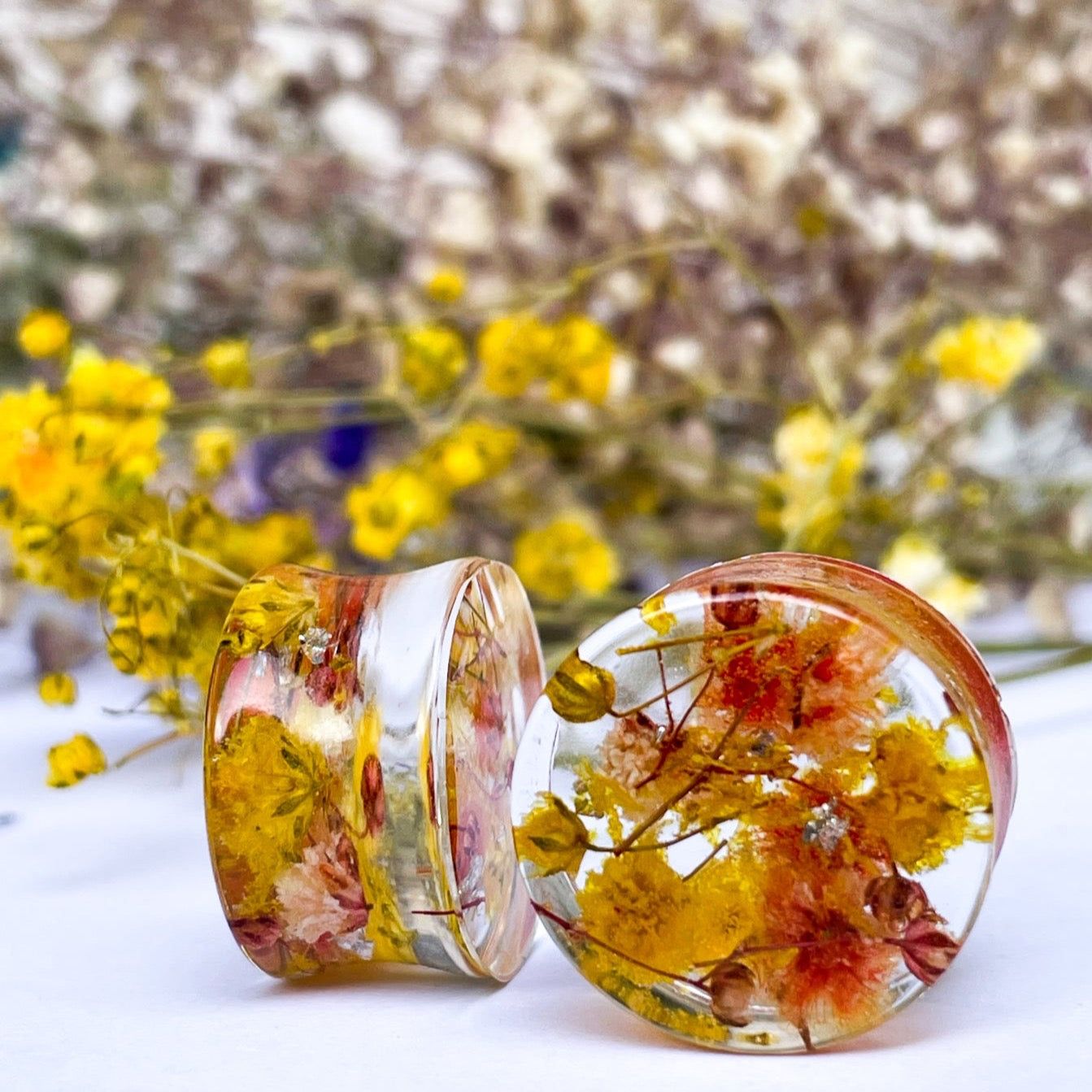 Yellow and Orange flower ear gauges