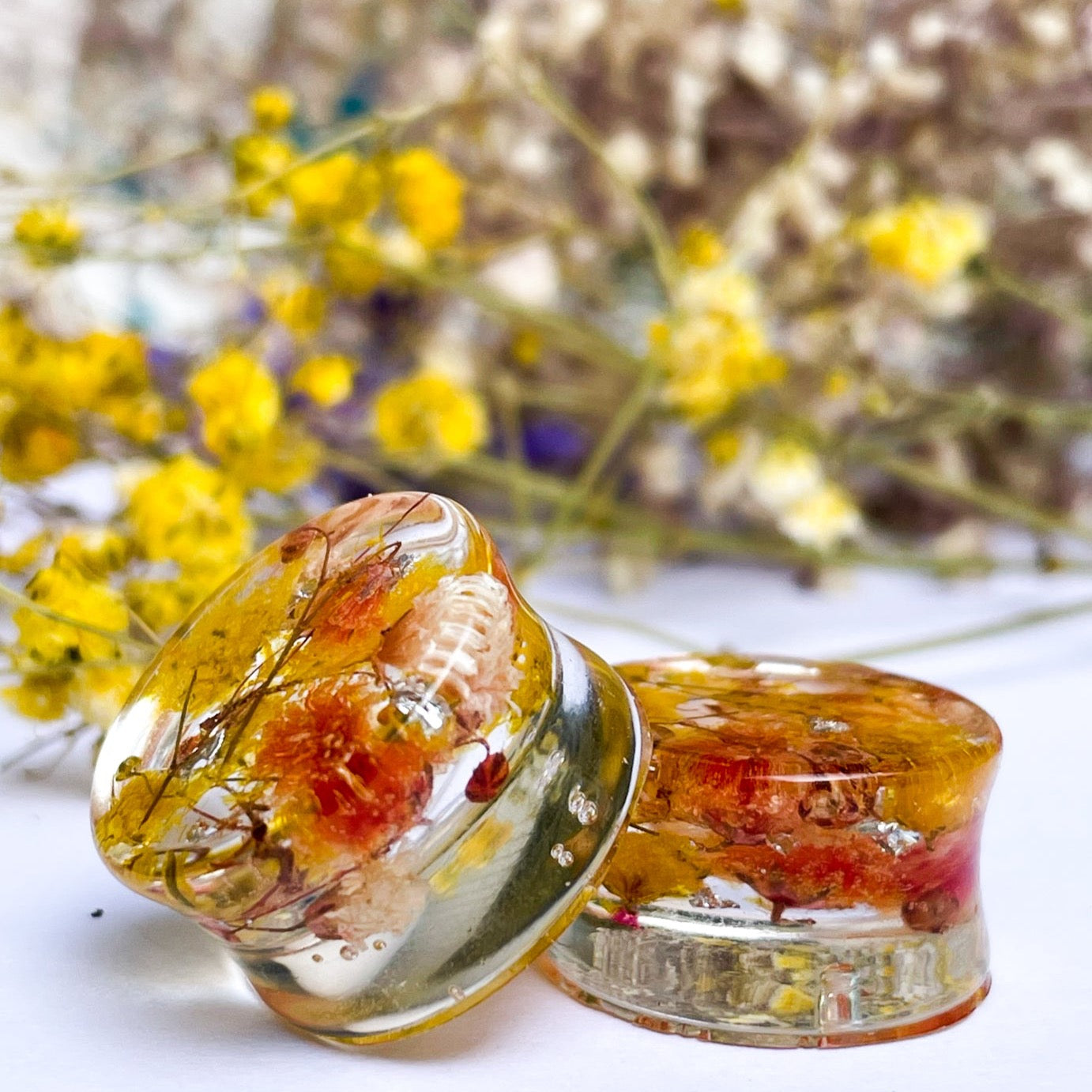 Yellow and Orange flower ear gauges