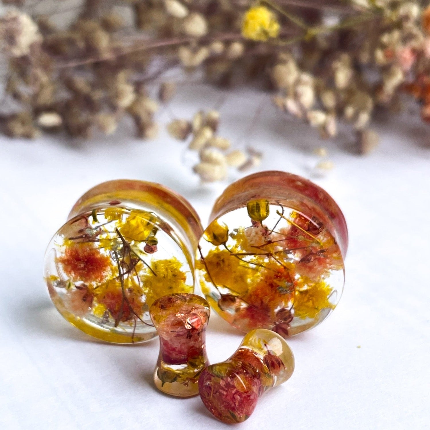 Yellow and Orange flower ear gauges