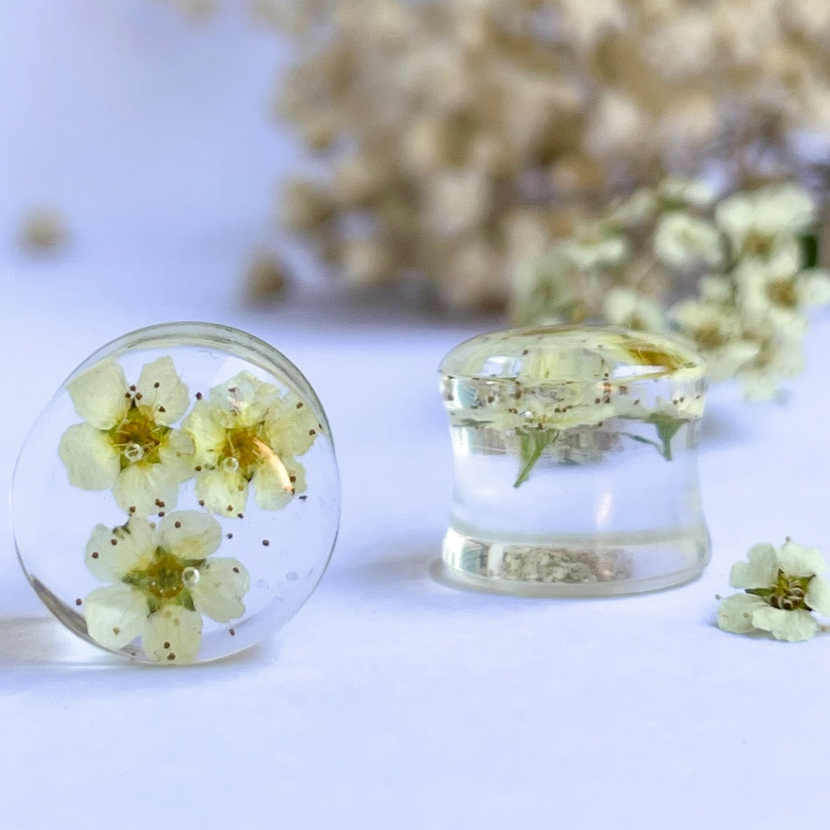 White and Yellow flower transparent ear gauges