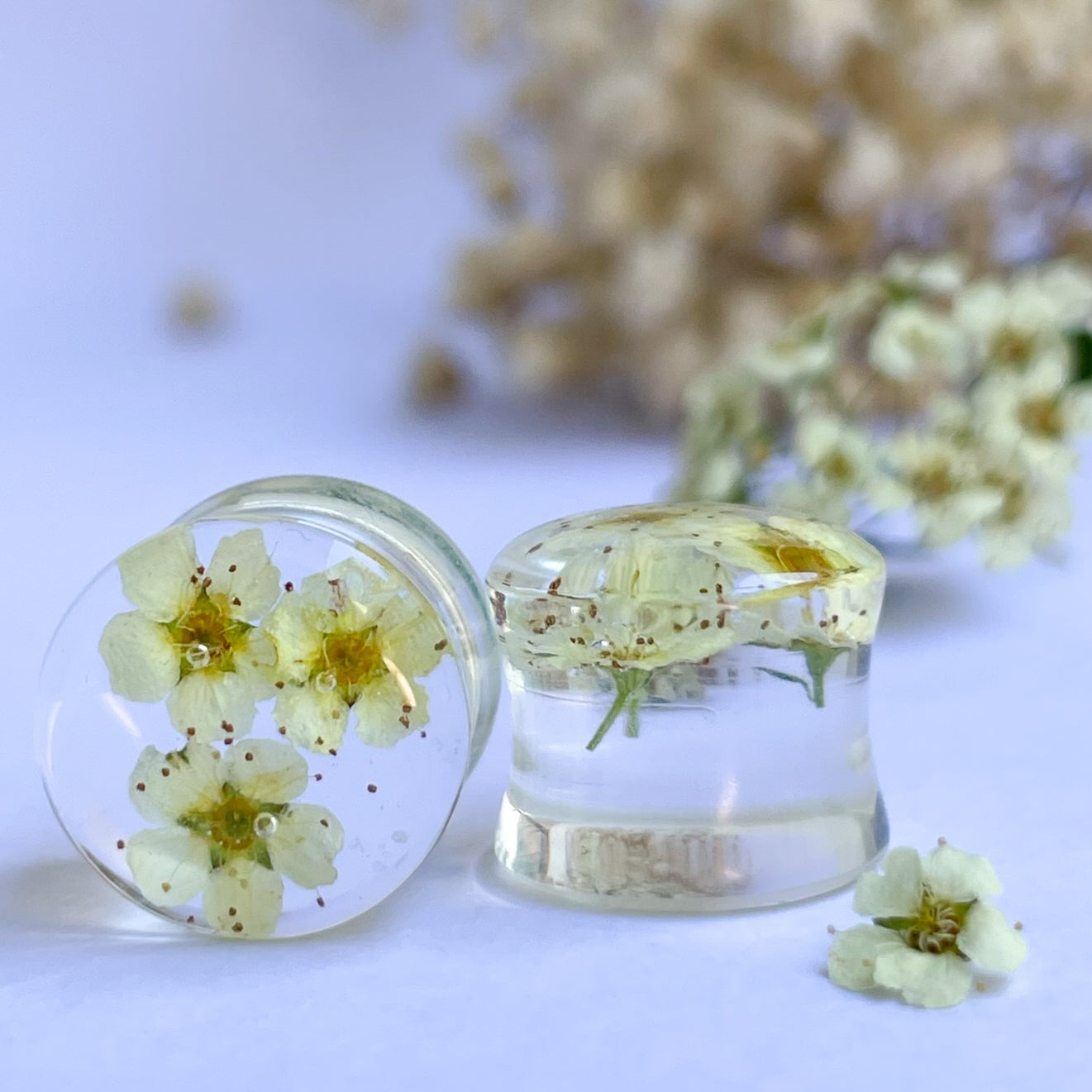 White and Yellow flower transparent ear gauges