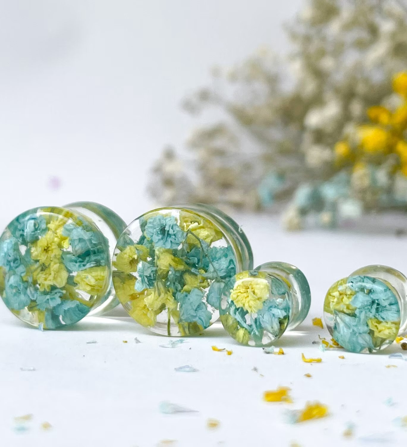 Blue and yellow flower ear gauges