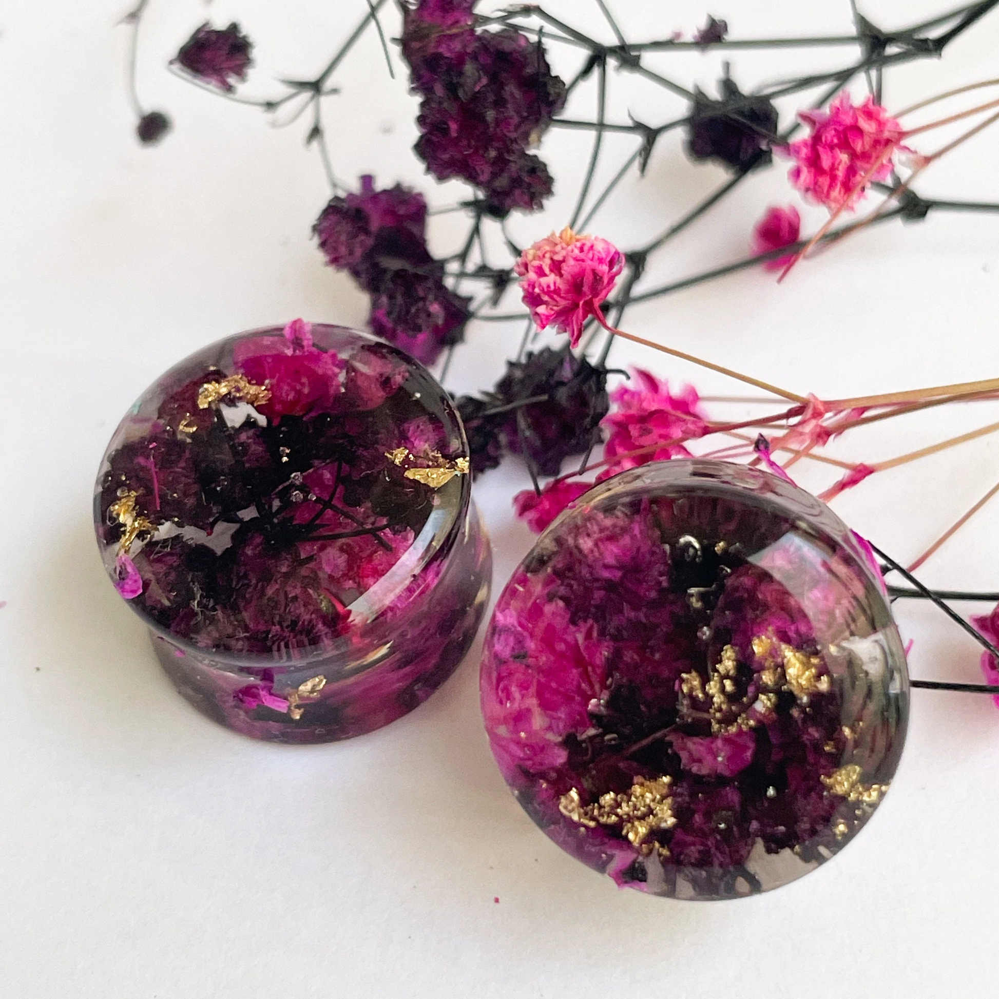 Black and Pink flower ear gauges with gold colour flakes