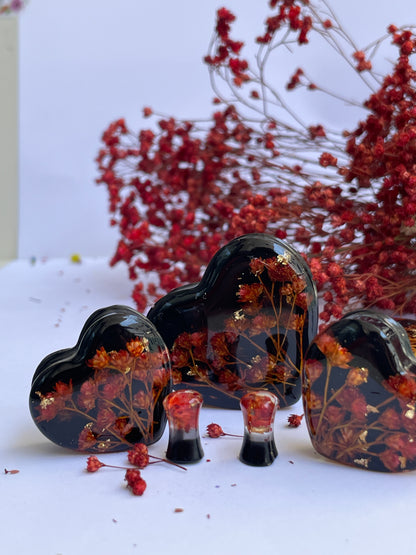 Orange flowers with black background heart shape ear gauges