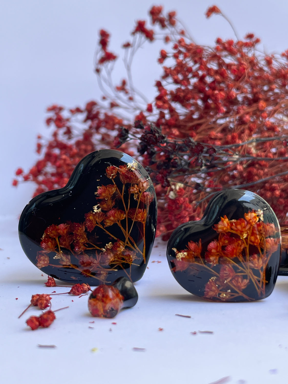 Orange flowers with black background heart shape ear gauges