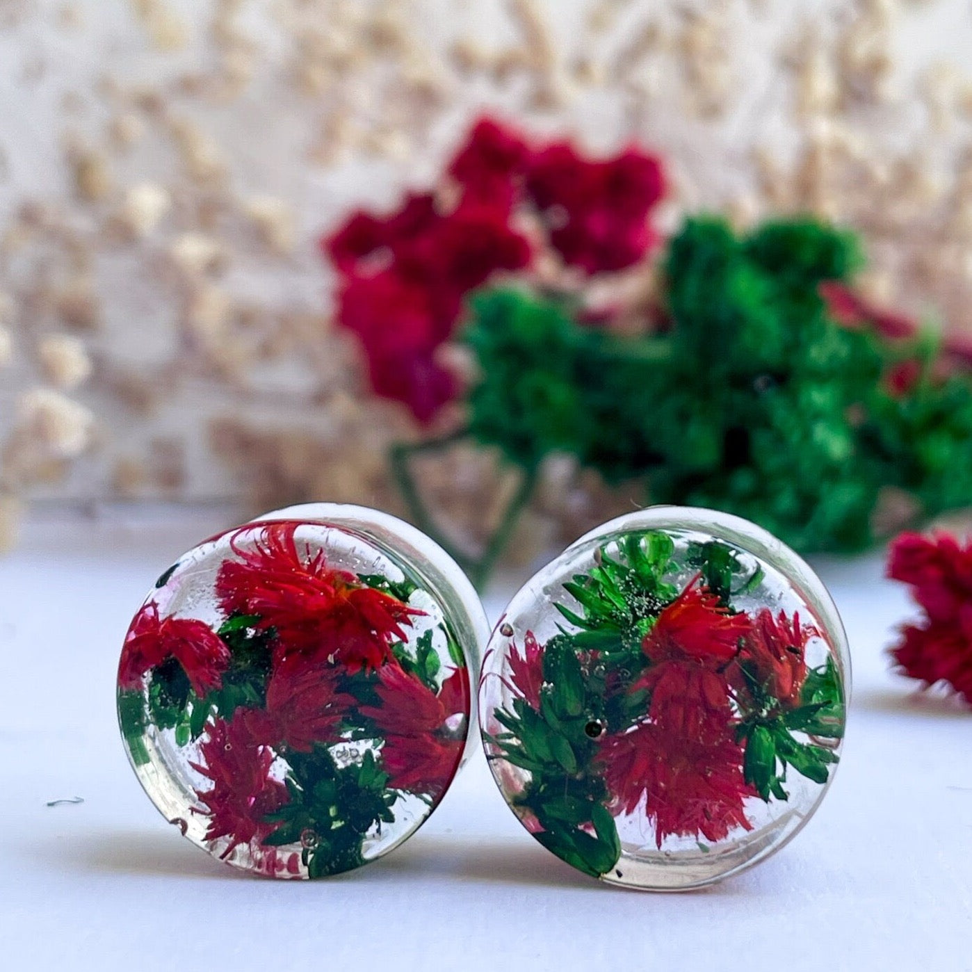 Red and Green flower ear gauges