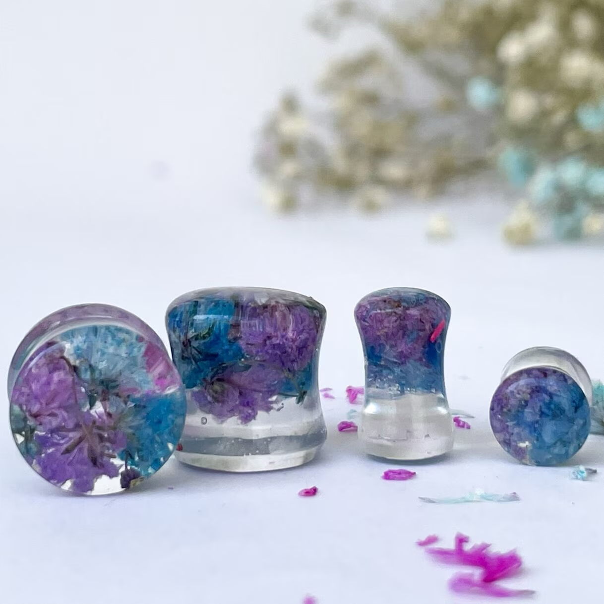 Blue and purple flower ear gauges