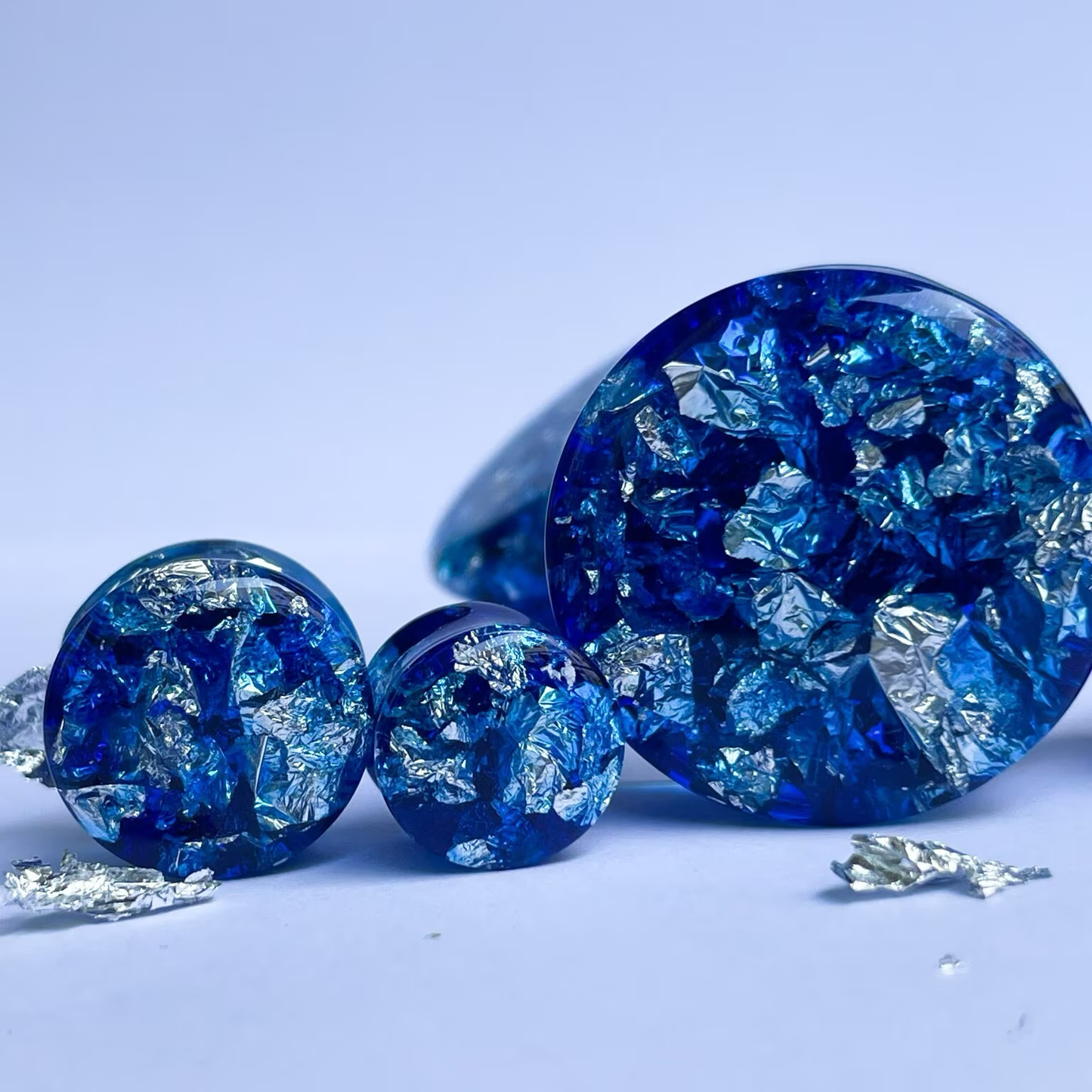 Blue resin and silver colour flake ear gauges