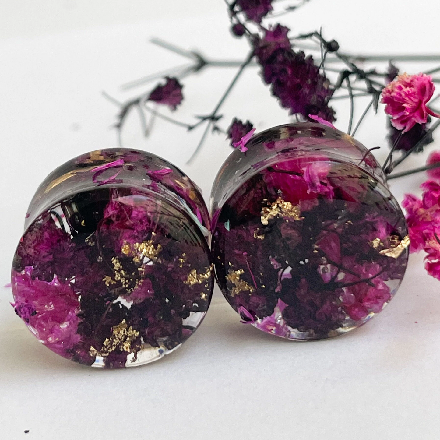 Black and Pink flower ear gauges with gold colour flakes