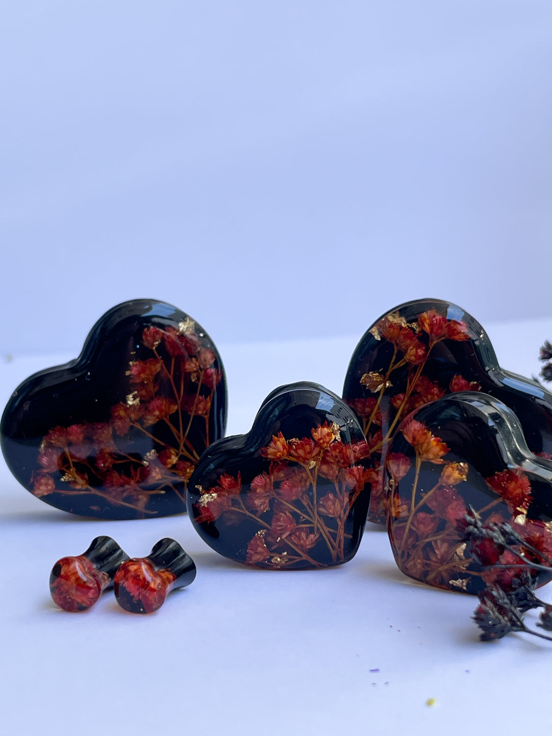 Orange flowers with black background heart shape ear gauges