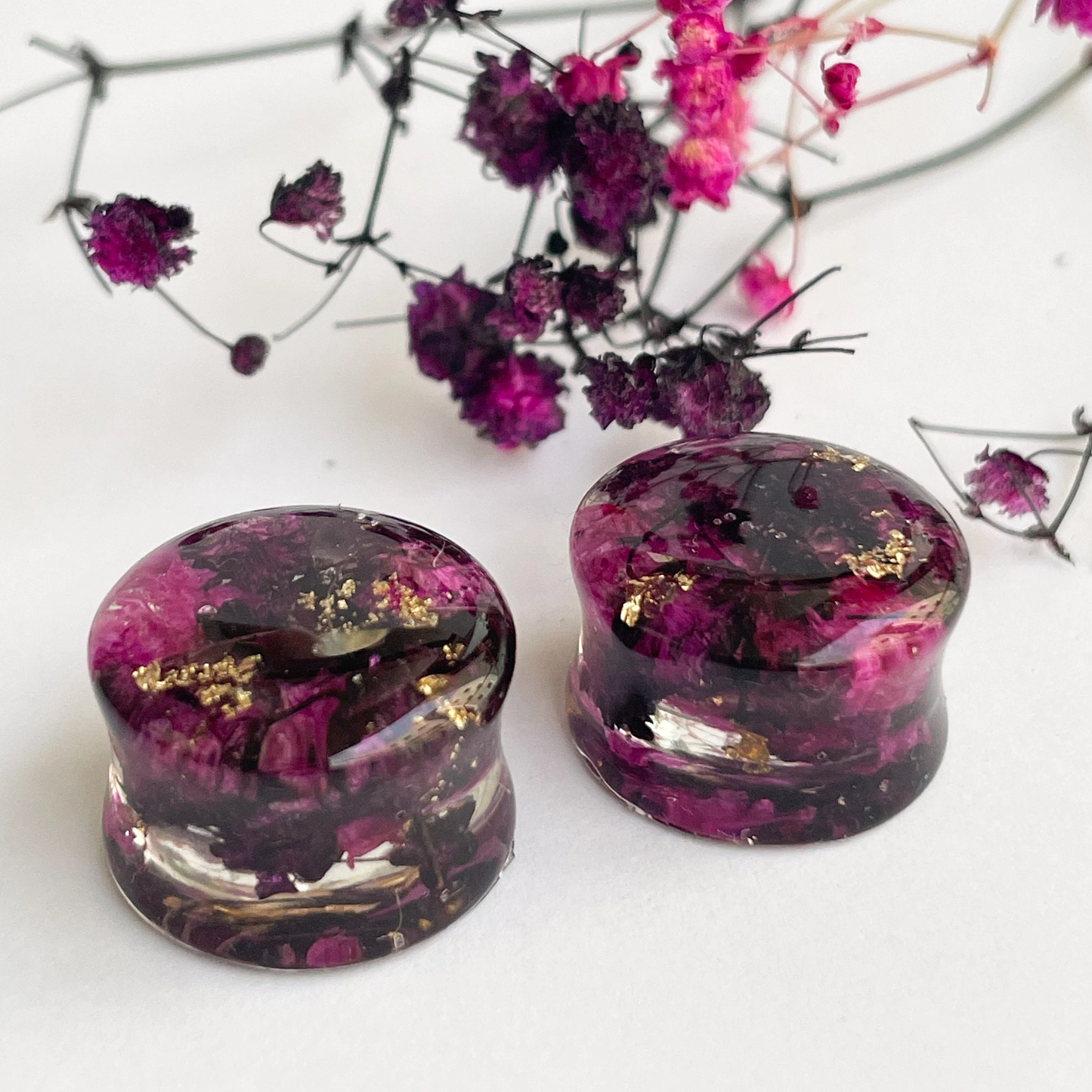 Black and Pink flower ear gauges with gold colour flakes