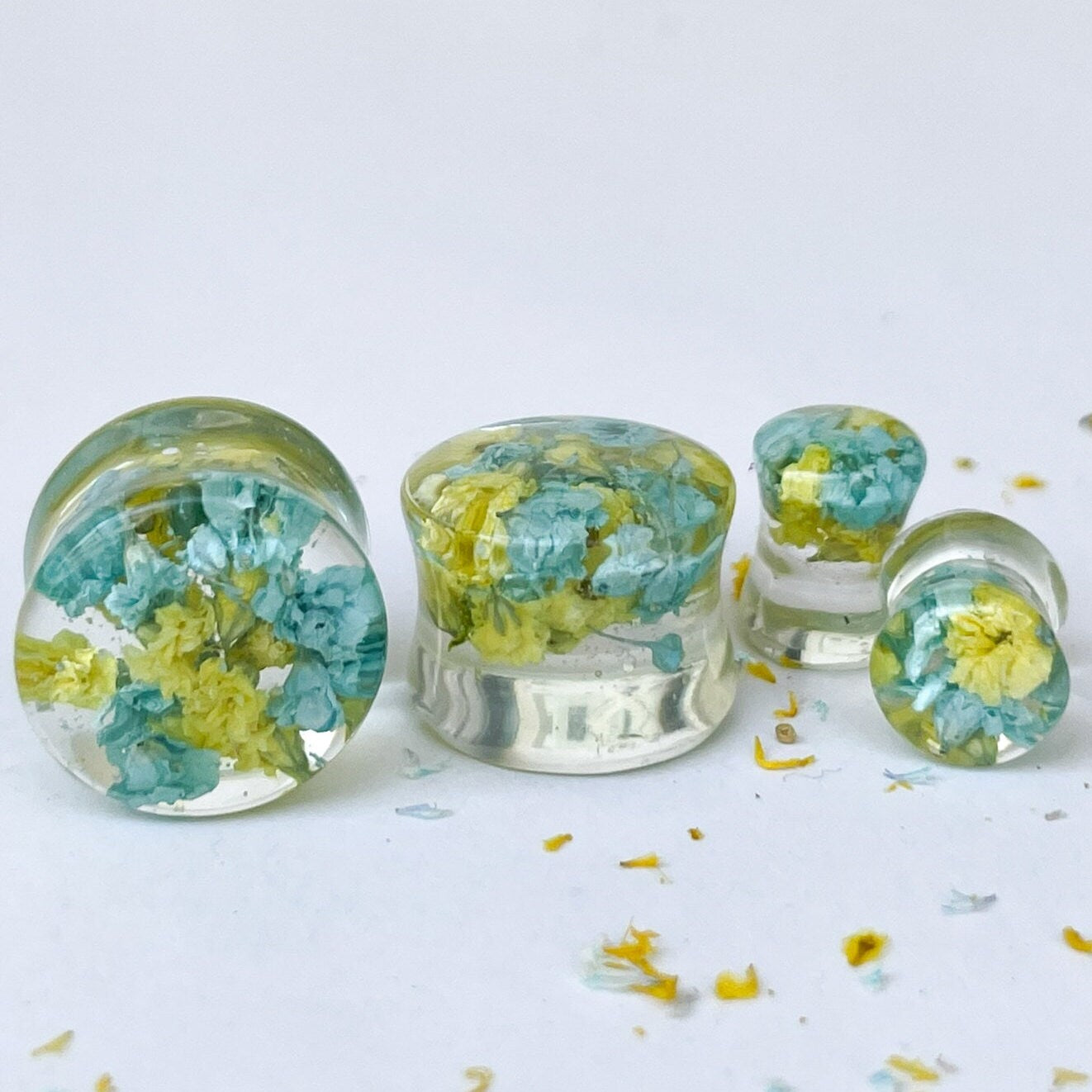 Blue and yellow flower ear gauges