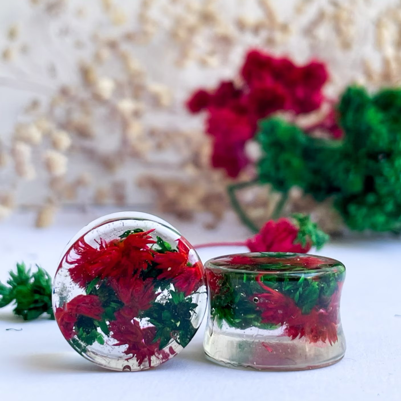 Red and Green flower ear gauges