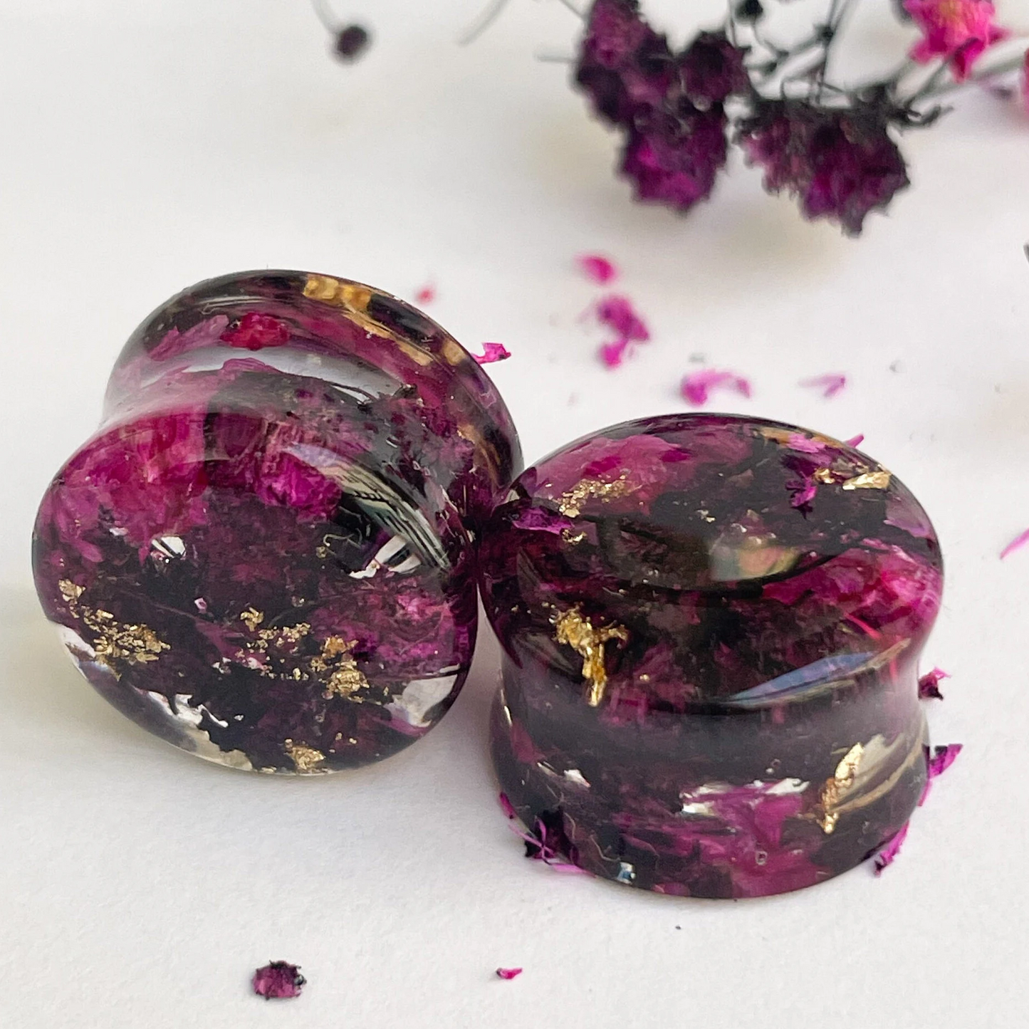 Black and Pink flower ear gauges with gold colour flakes