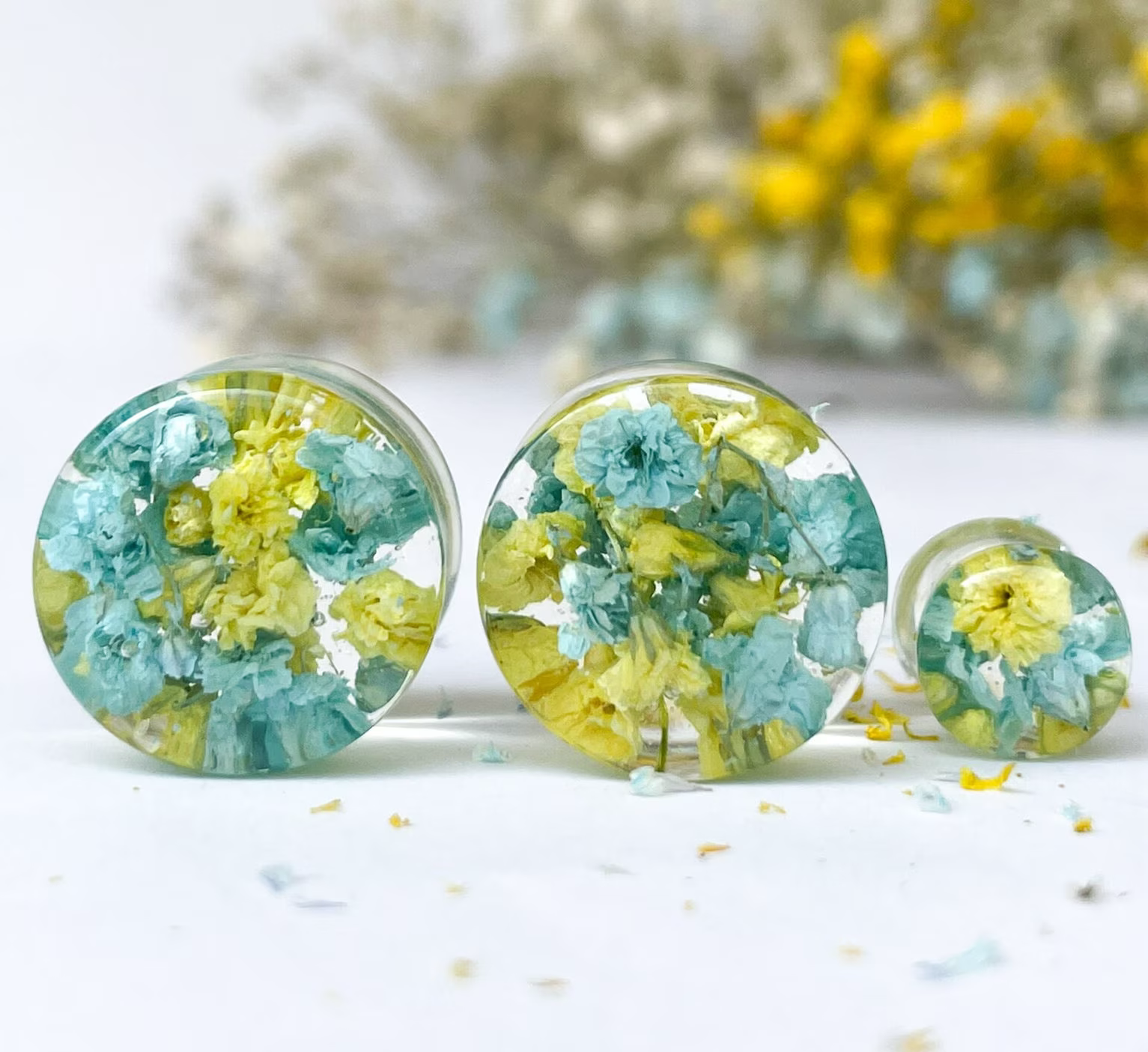 Blue and yellow flower ear gauges