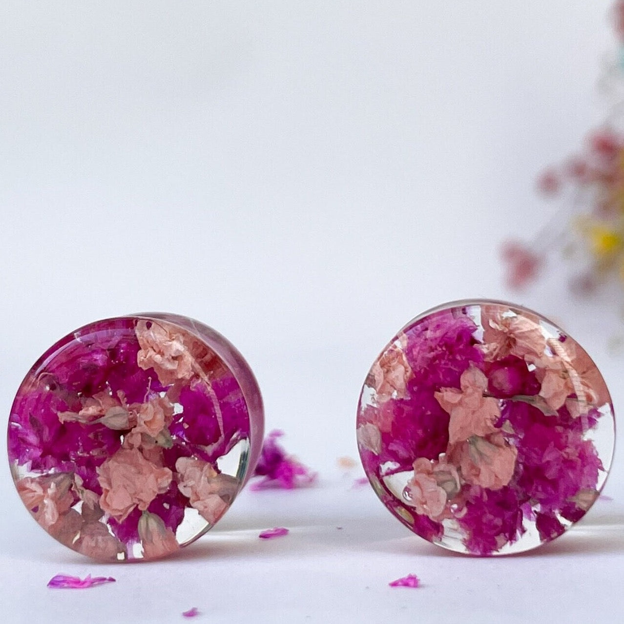 Dark pink and light pink flower ear gauges