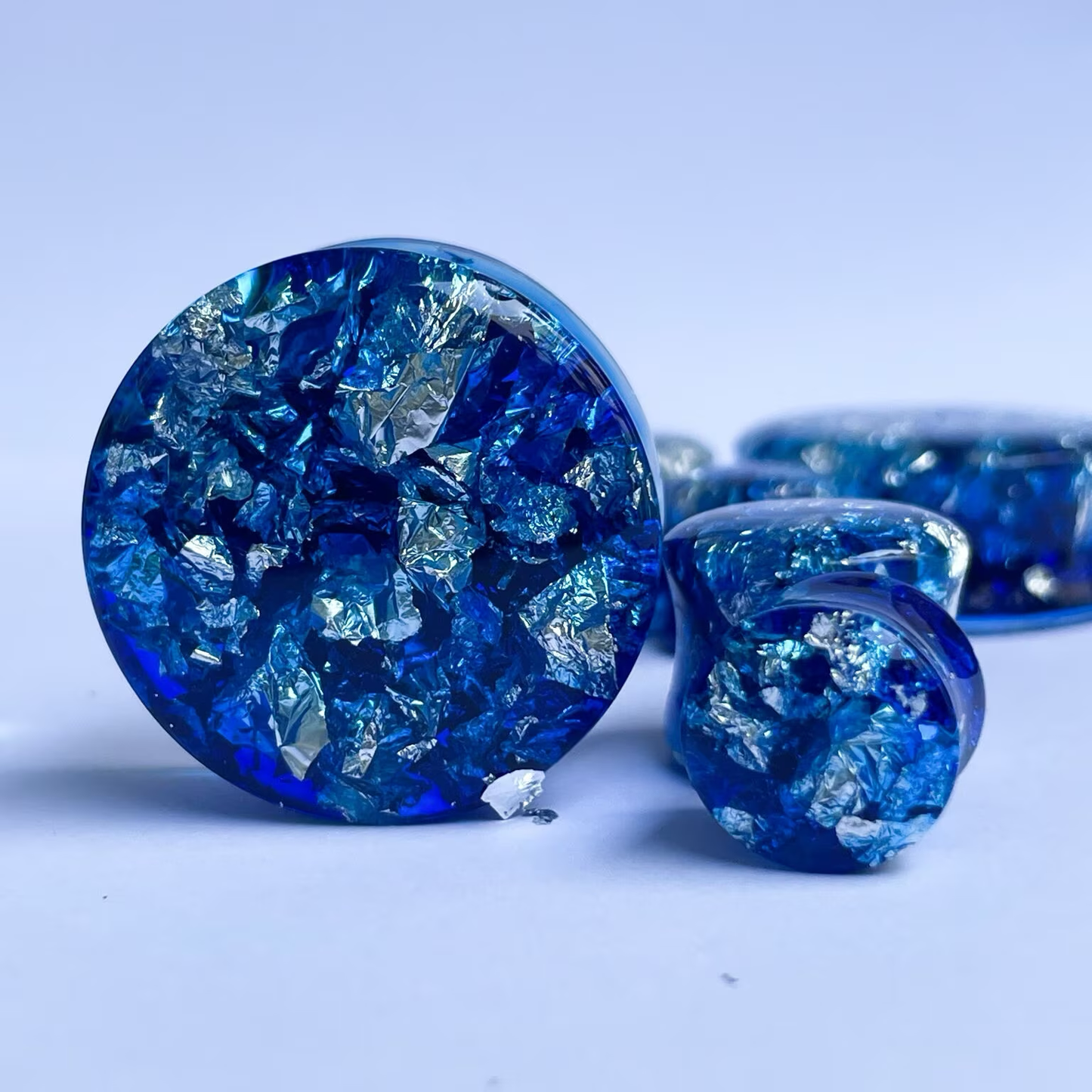 Blue resin and silver colour flake ear gauges