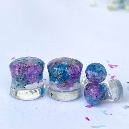 Blue and purple flower ear gauges