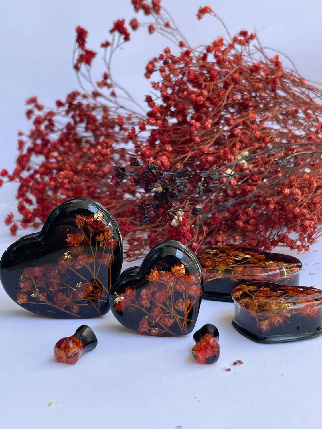 Orange flowers with black background heart shape ear gauges