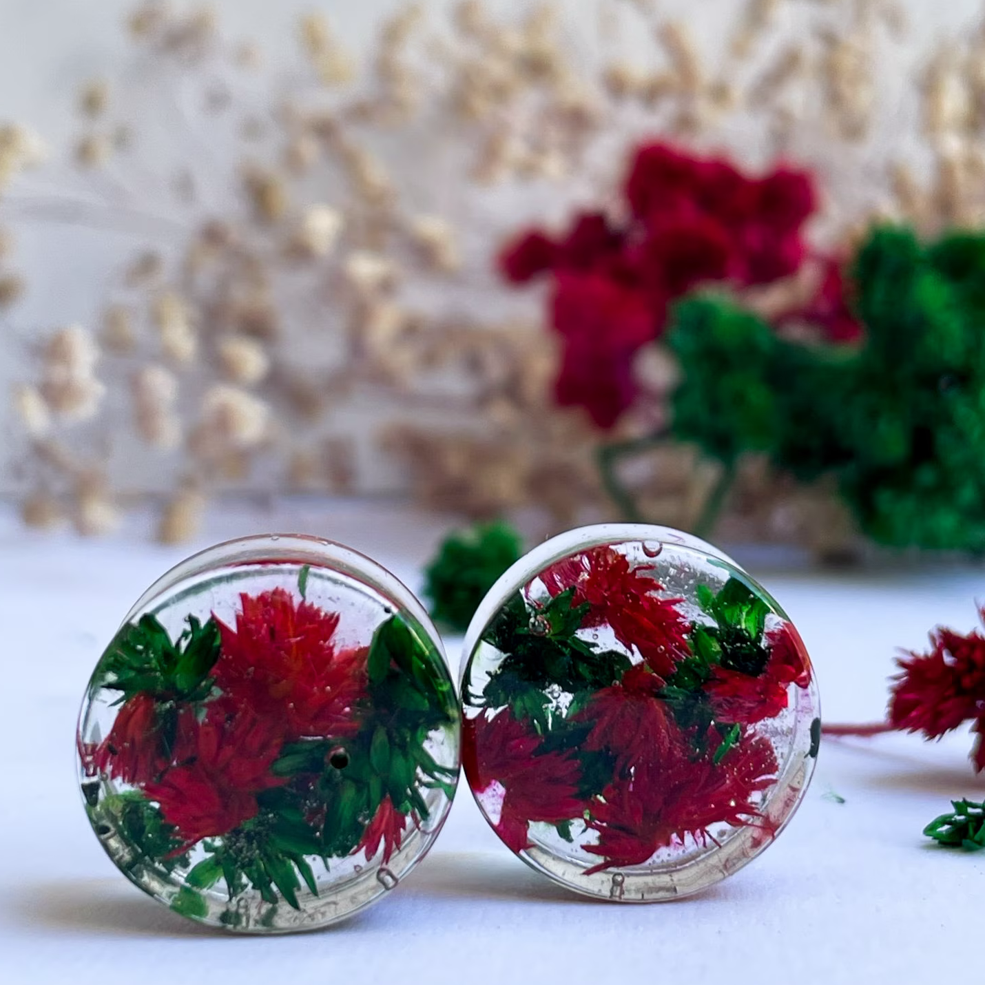 Red and Green flower ear gauges