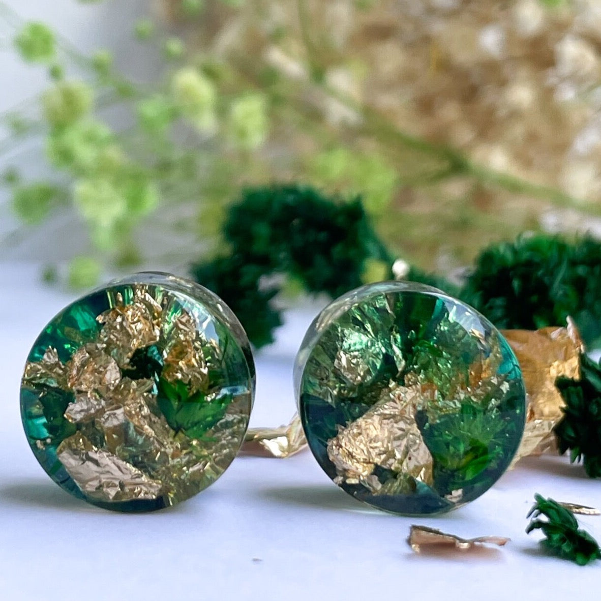 Gold flake and green colour ear gauges