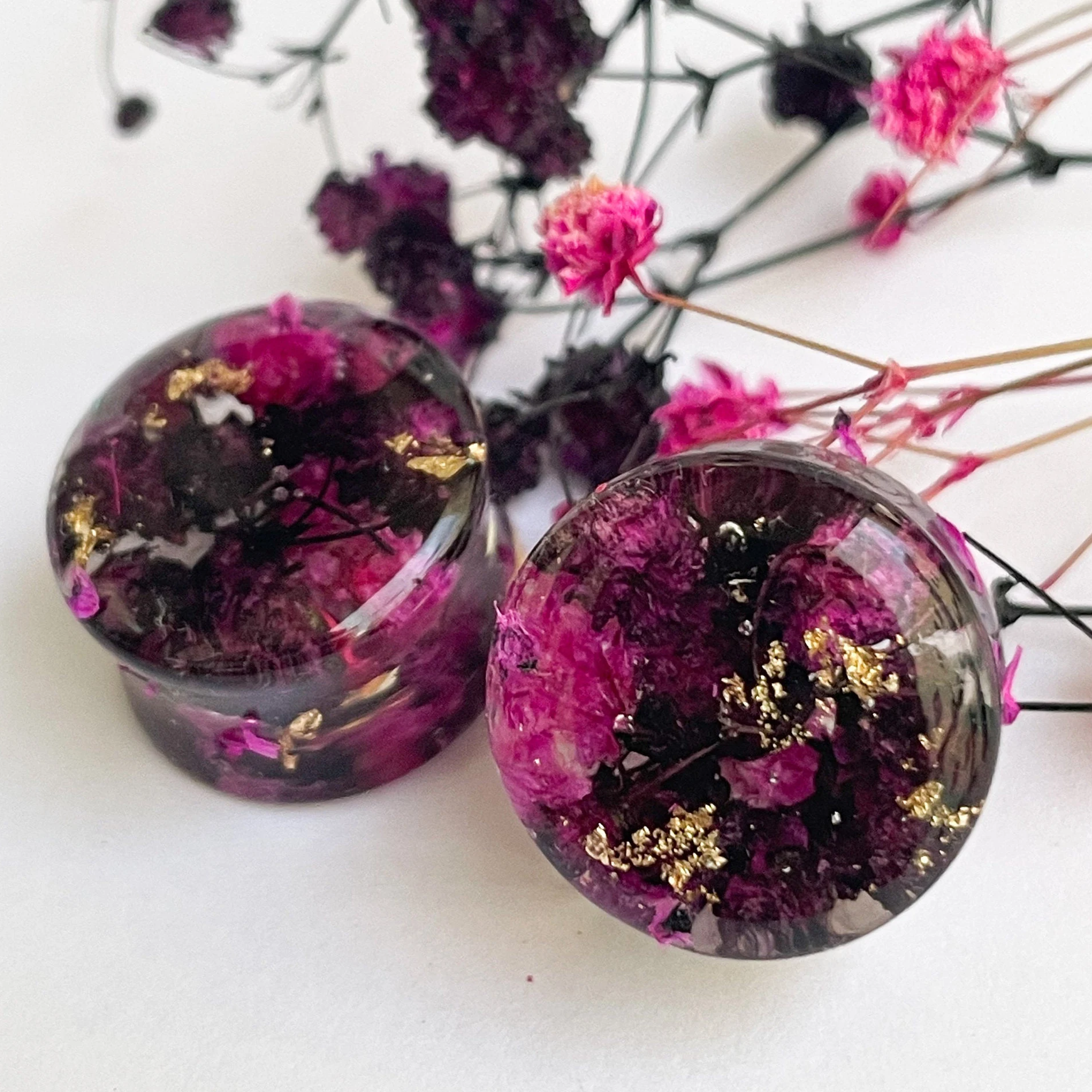 Black and Pink flower ear gauges with gold colour flakes