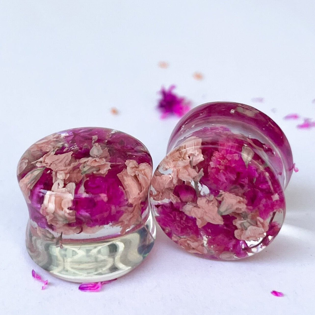 Dark pink and light pink flower ear gauges