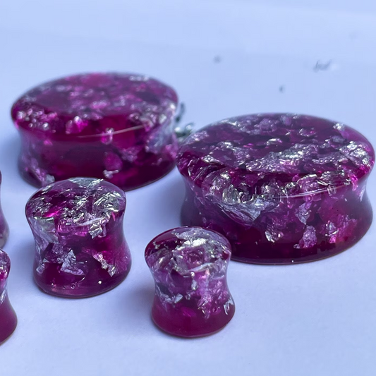 Dark pink resin ear gauges with gold colour flakes